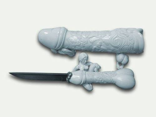 A dagger with a white porcelain handle and sheath moulded to look like erect penises.