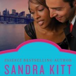 Book cover for the Color of Love by Sandra Kitt. A black woman and a white man hug with the New York skyline behind them.