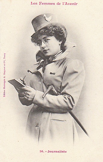 A black and white photo from 1902 of a woman journalist "in the future". A white woman holds a walking stick in the crook of her elbow and a pencil and  notepad in her hands.  She wears a trench coat and a top hat sits on her dark, curly hair.
