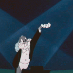 Animated gif of bugs bunny in a tux conducting an orchestra by holding his left arm up with his hand palm up and jiggling.