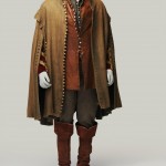 A brown cape lined by tiny buttons from hem to collar in the front and hem to shoulder at the arms. The embroidered arms of a coat peek out on the sides. A red-brown leather waitcoat is buttoned from waist to chest with the rest of the many buttons left undone. Dark brown fitted breeches are tucked into tall brown leather boots with a wide cuff over the knee.